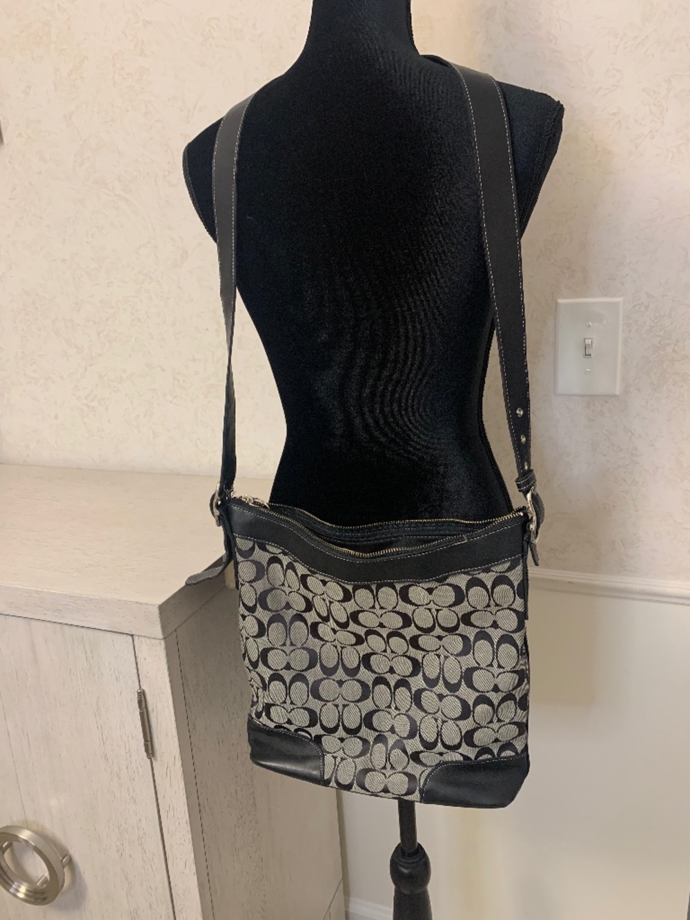 Black and gray Crossbody Coach bag